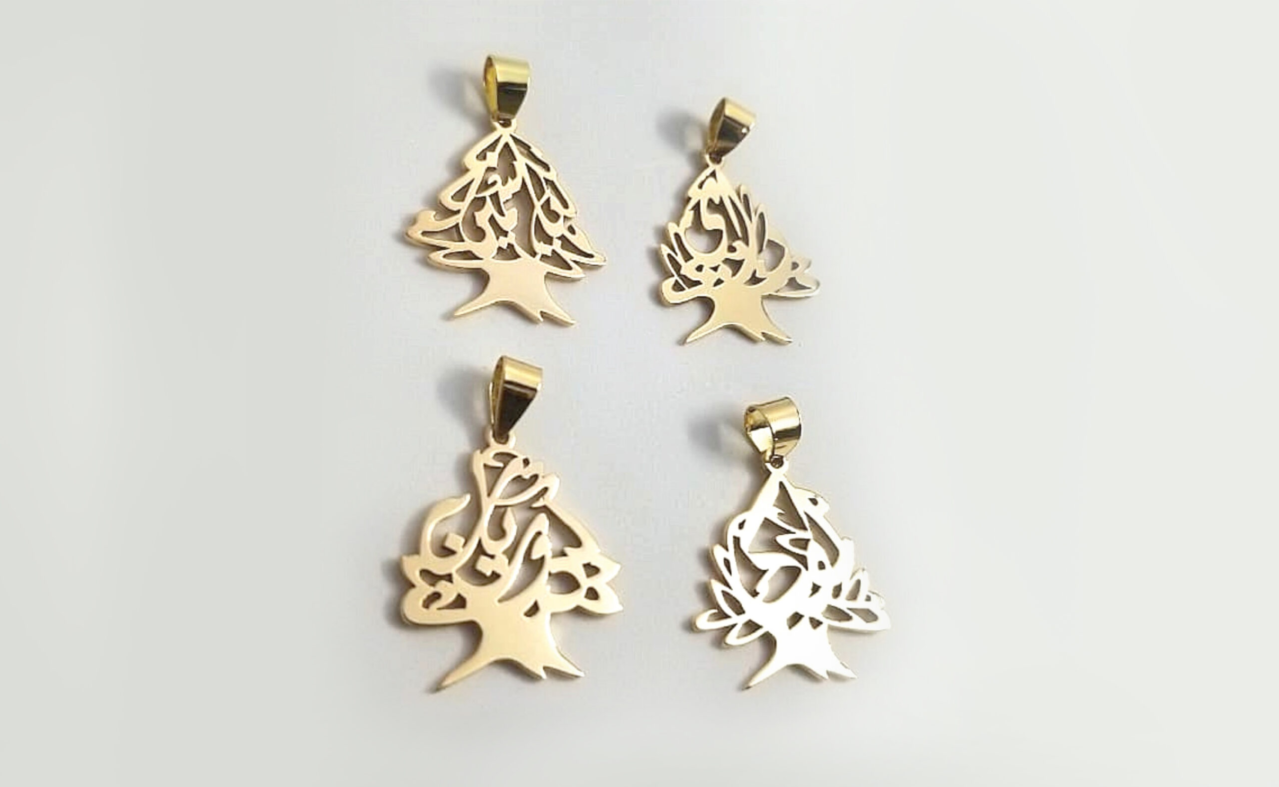 Customized Gold Cedar Tree Pendants adorned with Arabic calligraphy
